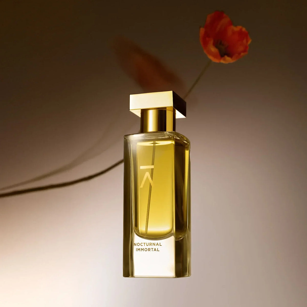 Azman Nocturnal Immortal parfum bottle with a red poppy