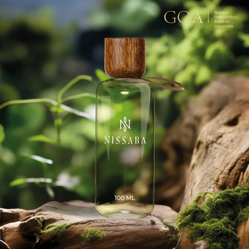 Nissaba Sulawesi eau de parfum bottle on mossy driftwood, Golden Osmanthus Awards finalist 2025