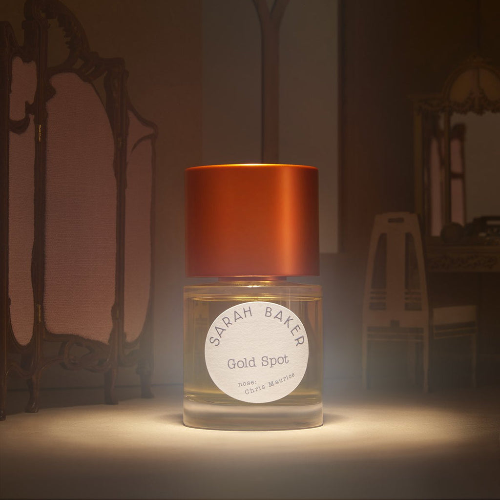 Sarah Baker Gold Spot spotlit in a vintage dressing room
