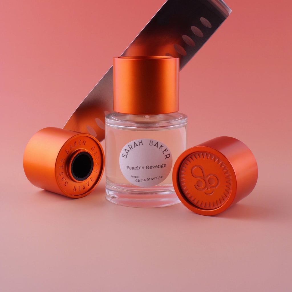 Sarah Baker Peach's Revenge bottle with copper caps and a chef's knife