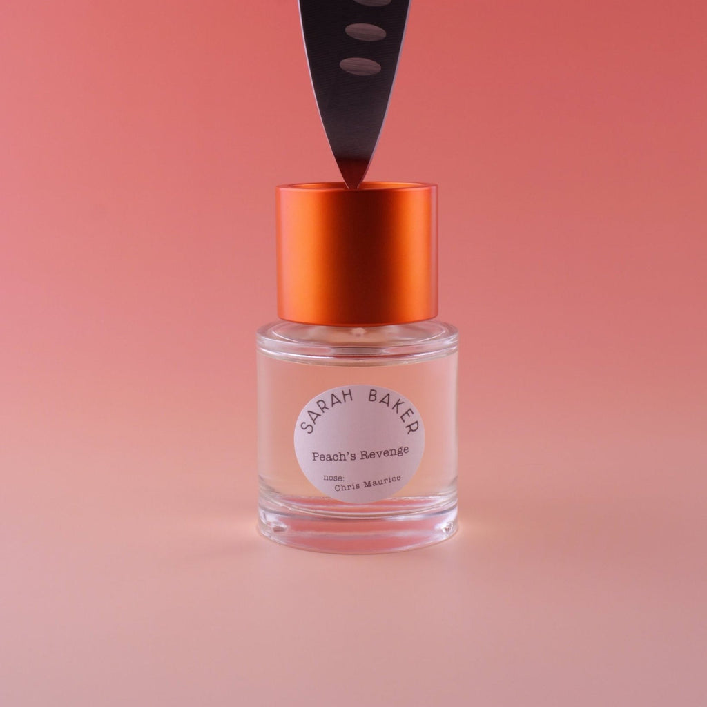 Sarah Baker Peach's Revenge with a blade resting on the cap