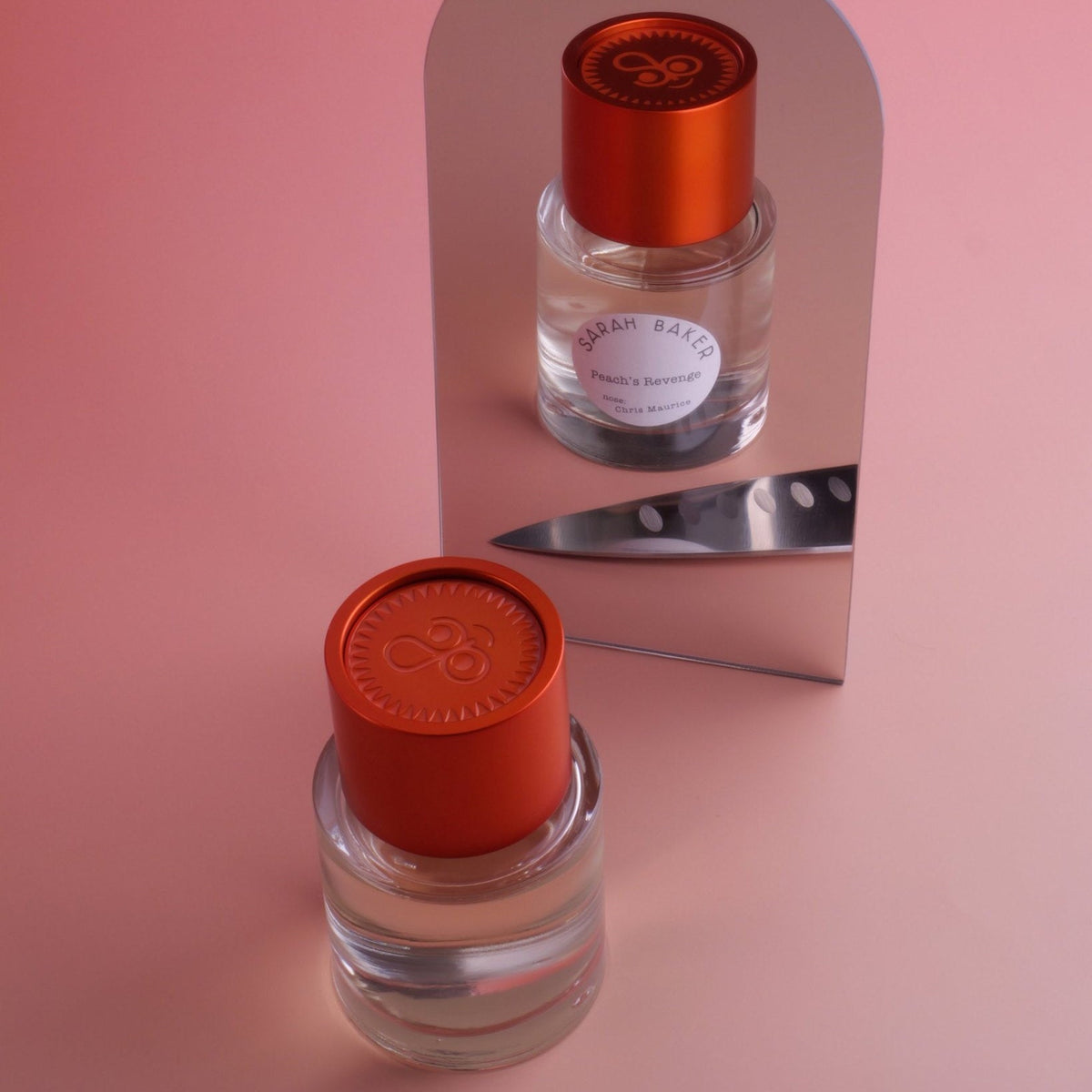 Sarah Baker Peach's Revenge stacked bottles with a knife