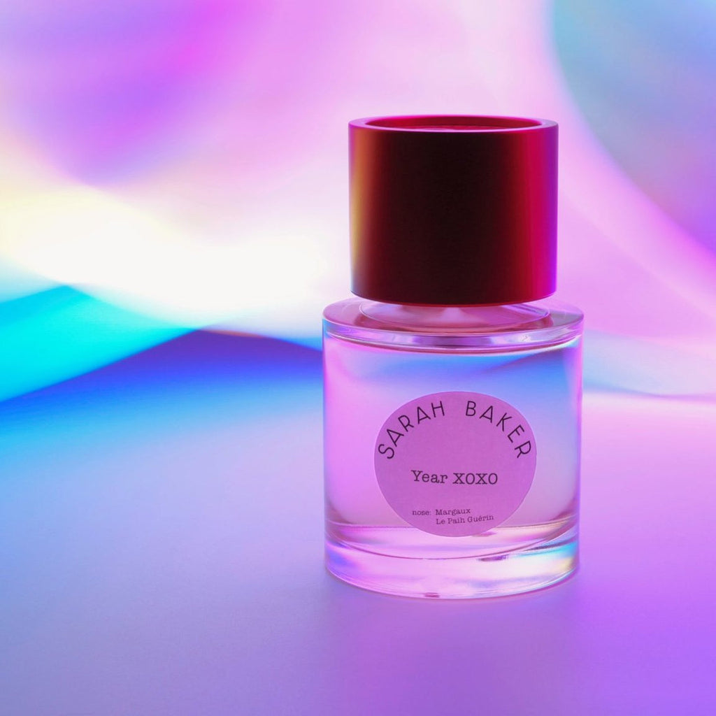 Sarah Baker Year XOXO in pink and violet light
