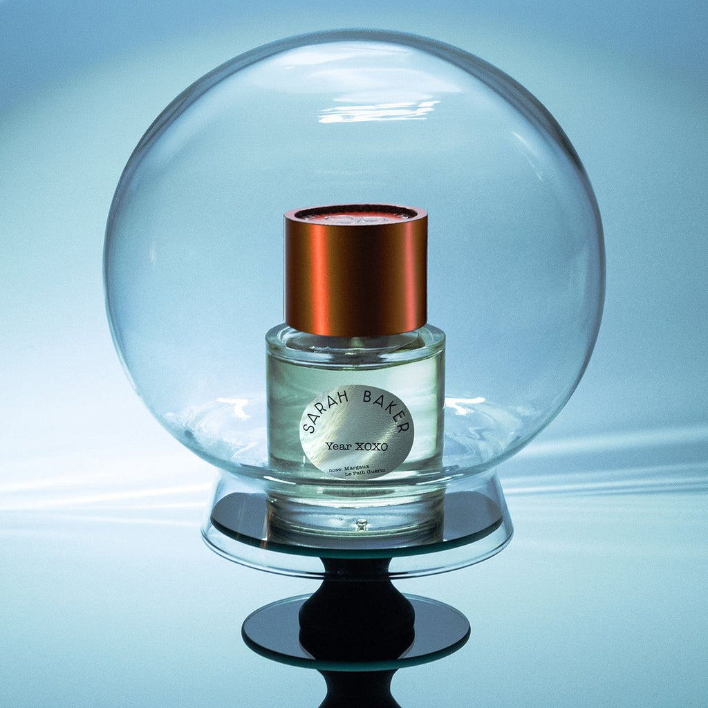 Sarah Baker Year XOXO under a glass globe