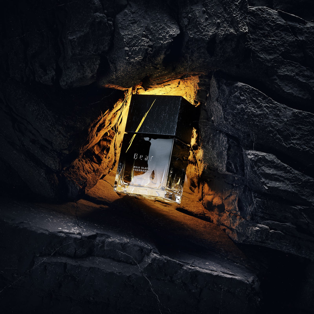 Wolf Brothers Bear eau de parfum bottle lit amber in a rock hollow