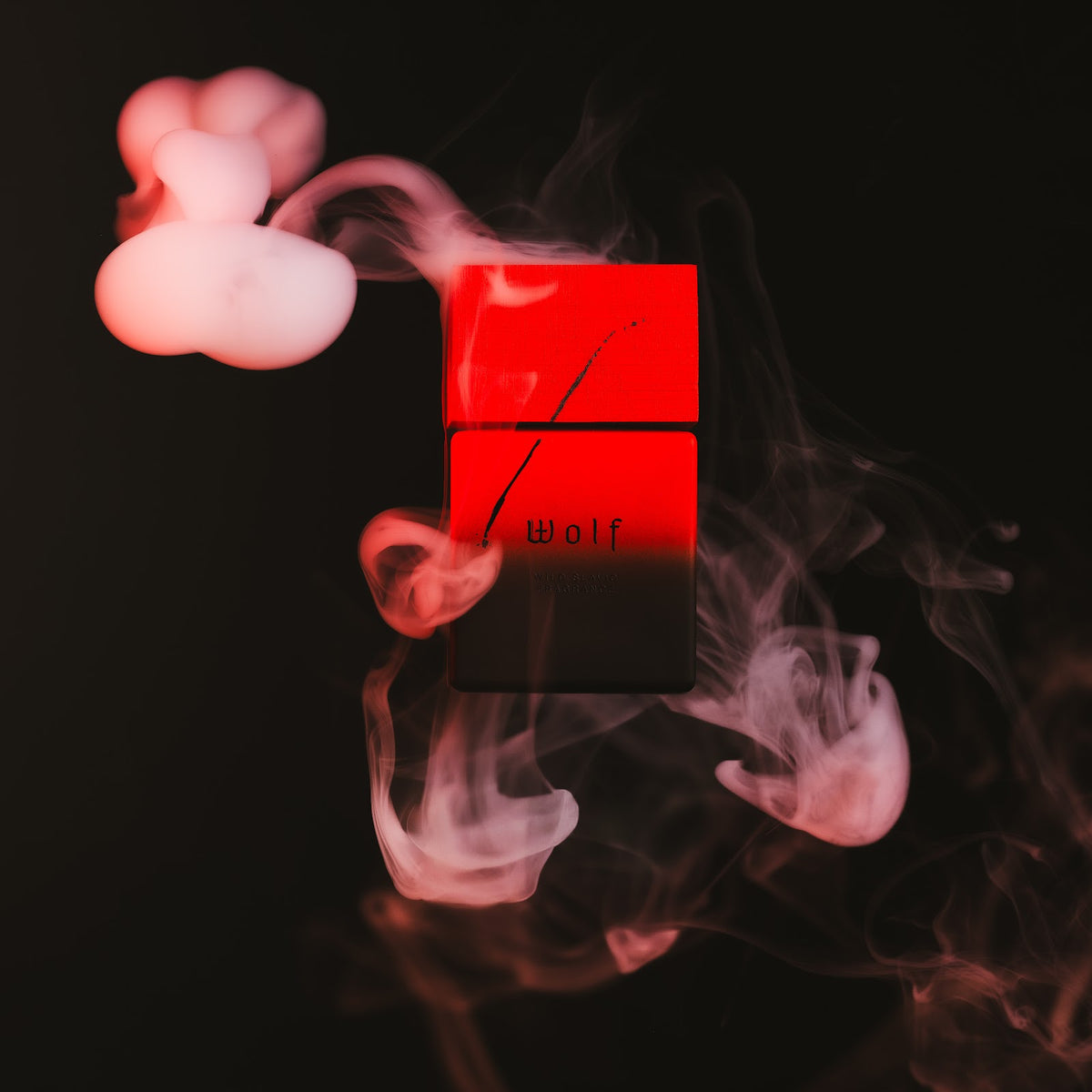 Wolf Brothers Wolf extrait de parfum bottle in red light with smoke
